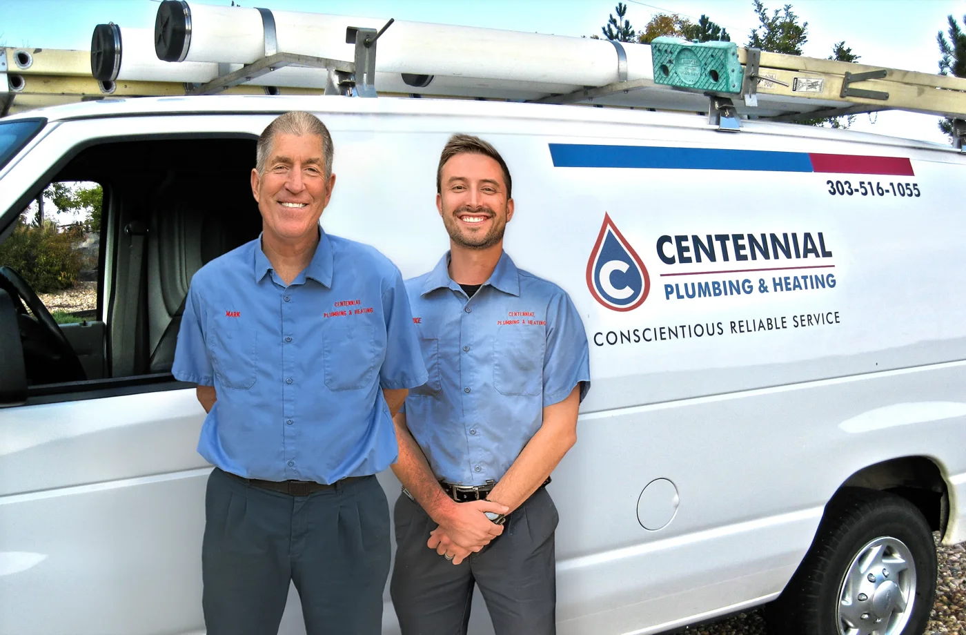 Mark and Mike Posthumus standing in front of the Centennial Plumbing and Heating service van